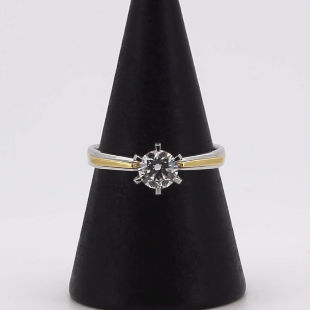 Video showcasing a stunning two-tone diamond engagement ring in 18K solid gold, featuring a brilliant solitaire diamond with ethically sourced lab-grown diamonds. The ring is perfect for engagement or gifting, offering elegance and superior craftsmanship.
