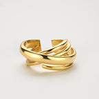 Skulpturaler Crossover Ring aus 7,50 g massivem 18K Gold mit mehrfach überkreuztem Design.